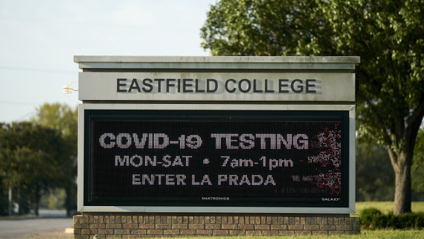 A sign for COVID-19 testing is displayed outside Dallas College Eastfield Campus in Mesquite, Texas.