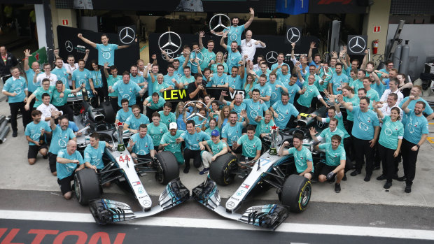 Team effort: The Mercedes Benz team celebrates after winning the constructor's title.