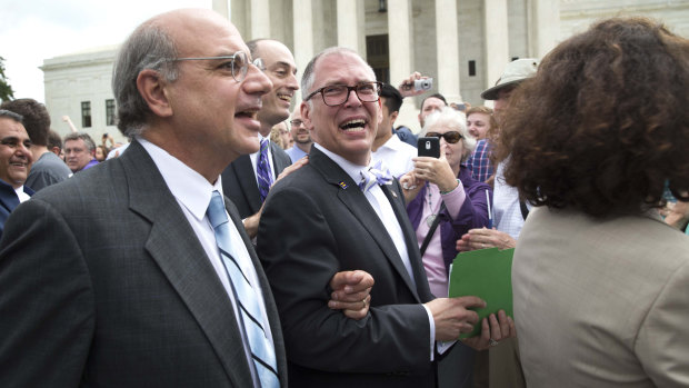 James Obergefell, centre, plaintiff in the same-sex marriage case Obergefell v Hodges, walks out of the Supreme Court following its ruling in June 2015.