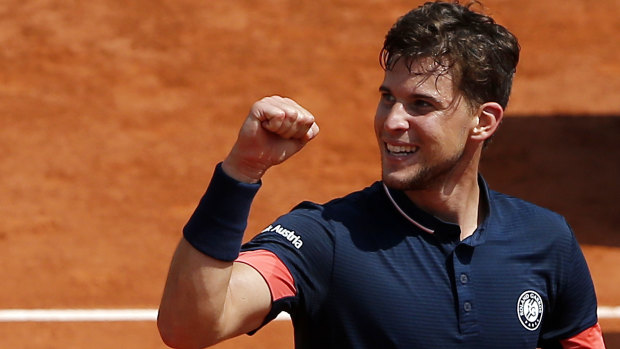 Austria's Dominic Thiem celebrates as he defeats Italy's Marco Cecchinato during their semifinal match of the French Open.