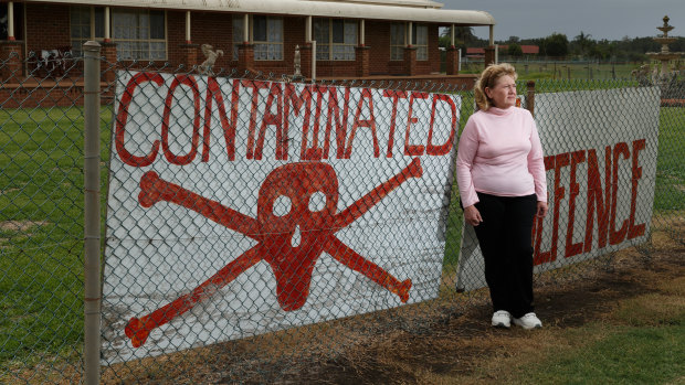 Williamtown resident Kim-Leeanne King celebrates an announcement that the PFAS class action has been settled..