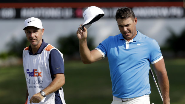 Front-runner: Brooks Koepka tips his cap as he leaves the 18th green after winning the World Golf Championships-FedEx St. Jude Invitational in Memphis.