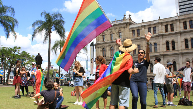 Crowds in Queens Garden, Brisbane, celebrate the Yes vote's same-sex marriage postal survey win in November 2017.