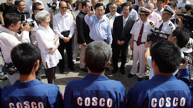 China's then vice-premier Zhang Dejiang addresses workers in Piraeus in 2010.  