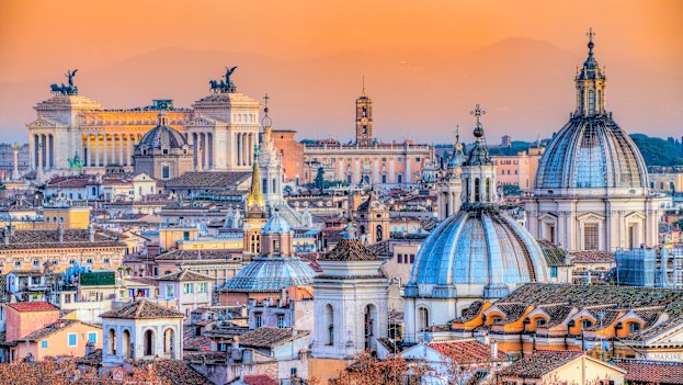Rooftop this: a sunset view looking across the multi-domed skyline of the Eternal City.