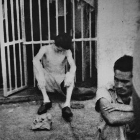 An emaciated prisoner sits against the bars of a cell at the Cabana Fortress in Havana in this photo smuggled out by a former Cuban rebel officer, Lt. Hirm Gonzalez. February 12, 1962.