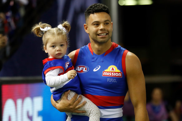 Jason Johannisen with his daughter Lola. Their family needs a more spacious home.