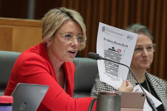 Labor’s then deputy Senate leader Kristina Keneally holds up the Herald’s blacked-out front page in 2019,  on the day mastheads around the country protested in the same way as part of the Your Right to Know campaign.