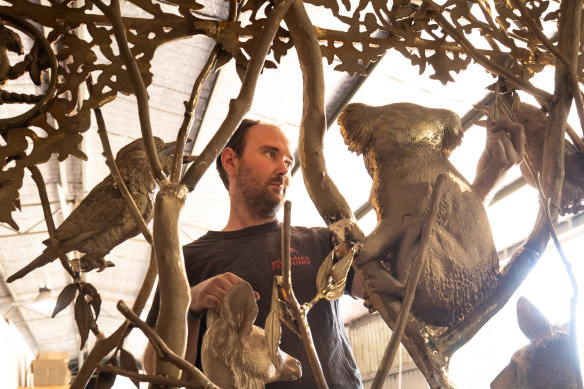 Travis Billman at work on the throne in his foundry. 