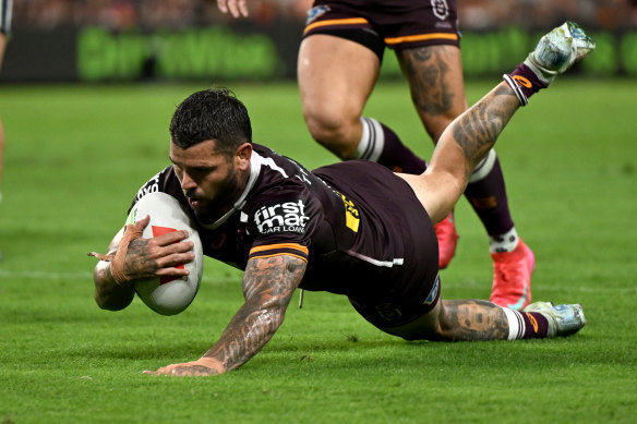 Adam Reynolds scores for the Brisbane Broncos against the North Queensland Cowboys.