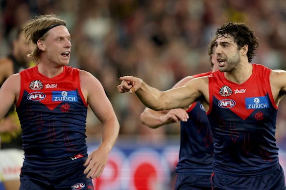 Christian Petracca and Charlie Spargo celebrate a Melbourne goal.