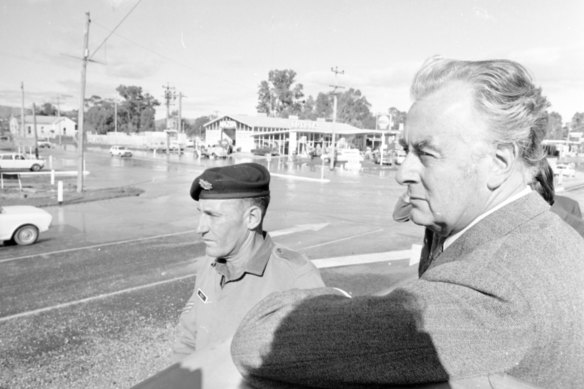 Prime Minister Gough Whitlam surveys the flood damage at Seymour.