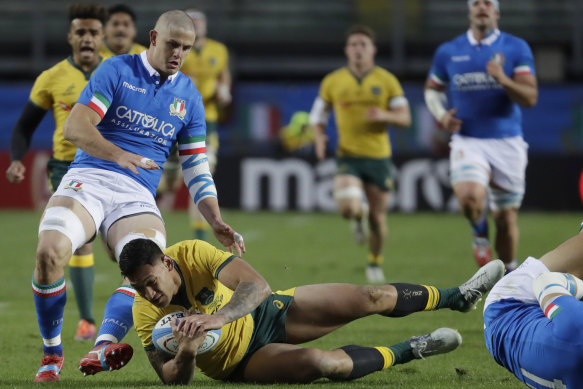 Israel Folau is tackled during Australia’s last Test against Italy in 2018. 