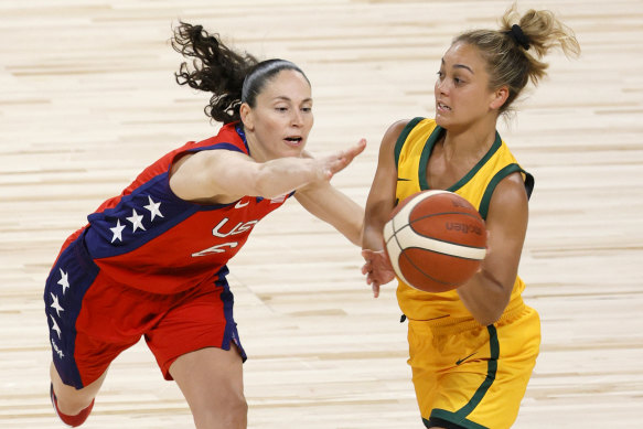 Leilani Mitchell of the Opals passes against Sue Bird from the US basketball team.