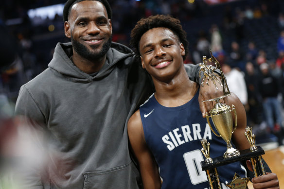 LeBron James, left, poses with his son Bronny in 2019.