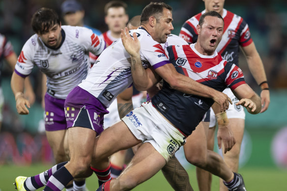 Cameron Smith, left, tackles Boyd Cordner in Melbourne's preliminary final loss to the Roosters. 