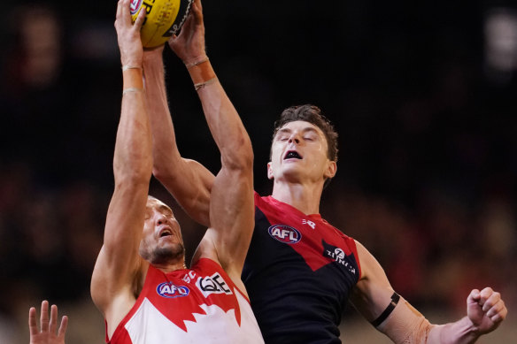 Jake Lever (right) competing for the ball with Sam Reid of the Swans on Friday night.