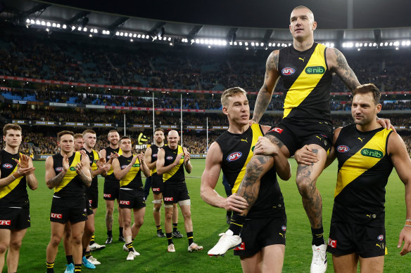 Dustin Martin is chaired from the field.