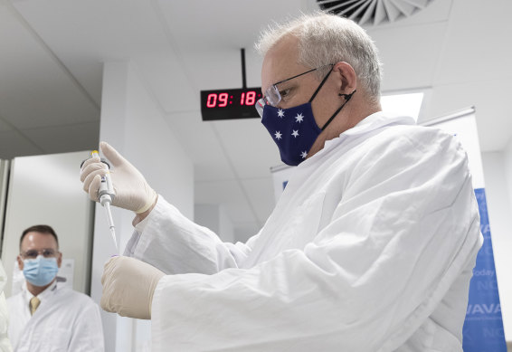 On the COVID case ... Prime Minister Scott Morrison takes a lab tour. 