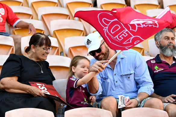 Fans watch the Reds at Suncorp Stadium.