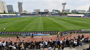 Port Adelaide players sign autographs during the week in Shanghai.