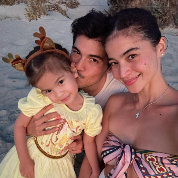 Curtis with her husband, Erwan
Heussaff , and their daughter, Dahlia, in Fremantle in January.