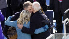 Joe Biden hugs first lady Jill Biden,  son Hunter and daughter Ashley after his swearing-in as Kamala Harris looks on. 