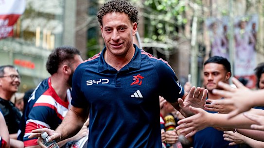 SYDNEY, AUSTRALIA - OCTOBER 01: Fans wave and greet Mark Nawaqanitawase of Sydney Roosters as he arrives with his team for a press conference ahead of the 2026 NRL Grand Final, at Martin Place on October 01, 2026 in Sydney, Australia. (Photo by Ayush Kumar/Getty Images)