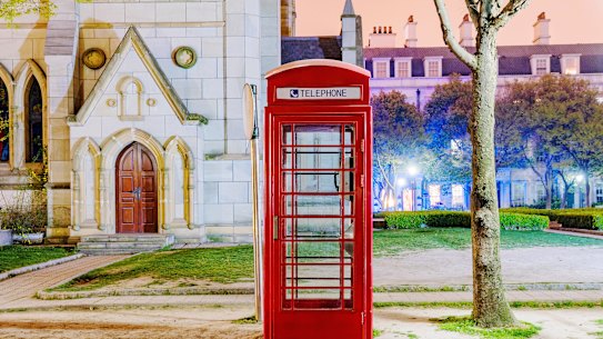 A bright red English-style phone booth in British-inspired Thames Town, Shanghai.