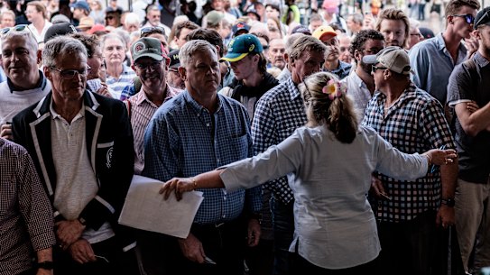 Margo Carson holds back the crowd on the opening day of the Sydney Test.