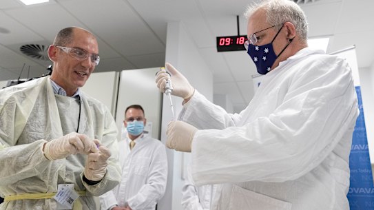 On the COVID case ... Prime Minister Scott Morrison takes a lab tour. 