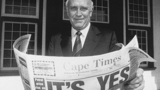 Then South African president F.W. de Klerk outside his office in Cape Town in 1992, holding a newspaper declaring a “Yes” result in the referendum to end apartheid and share power with the black majority for the first time.