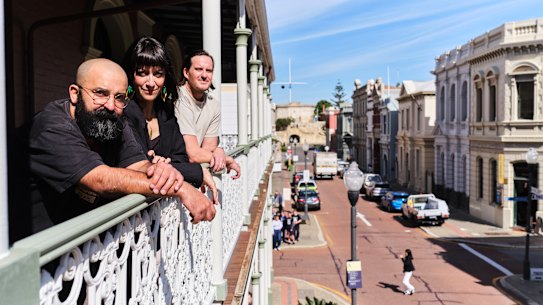 Room Service artists Joe Landro, Kate Hulett and Nic Brunsdon the balcony of the P&O Hotel in Fremantle.