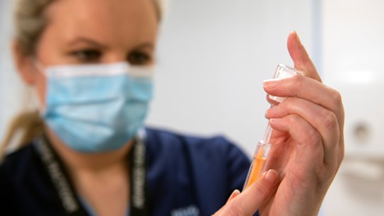 Advanced nurse practitioner Justine Williams prepares a dose of the AstraZeneca-Oxford vaccine at the Lochee Health Centre.