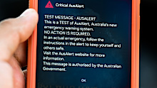 In this photo illustration, a critical AusAlert - Test Message notification appears on a smartphone July 27, 2026 in Sydney, Australia