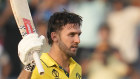 Mitchell Marsh celebrates his century against Bangladesh in Pune.