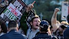 People protest against defence companies outside the Indo-Pacific 2025 International Maritime Exposition at Darling Harbour.