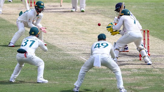 dia’s Rishabh Pant is surrounded by fieldsmen as he bats during play on the final day of the fourth cricket test between India and Australia at the Gabba, Brisbane, Australia, Tuesday, Jan. 19, 2021. (AP Photo/Tertius Pickard)