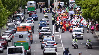 Protesters block Perth city bridge as they march for action on climate change