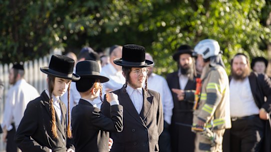 Members of the Adass Israel synagogue after the December arson attack.
