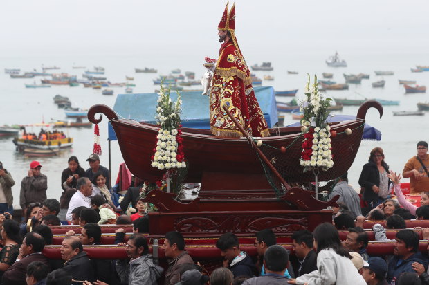 A Peruvian fishing community carries its patron saint. In the 1600s, fishermen coined El Nino (“little boy” or “Christ child”) to describe weather that left them low on seafood for Christmas.