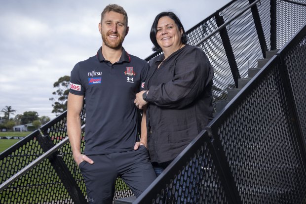 Dyson Heppell with Bobbie Lee Blay at Essendon’s base, ‘The Hangar’.