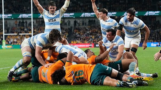 Argentinian players celebrate a try by teammate Juan Martin Gonzalez.