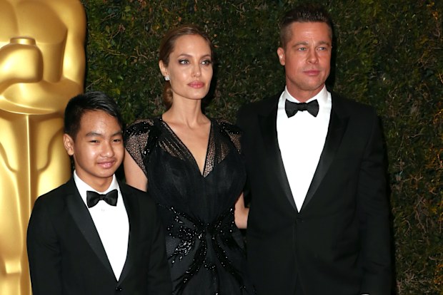Maddox Jolie-Pitt with parents Angelina Jolie and Brad PItt at the Academy of Motion Picture Arts and Sciences' Governors Awards in November 2013.