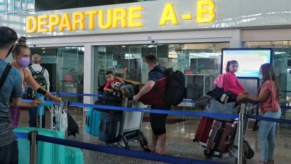 ‘We were crying’: Australians board relief flight from Bali but some vow to return
