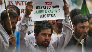 Supporters of the religious group Jamaat-e-Islami protest against India's policy on Kashmir, in Islamabad, Pakistan.