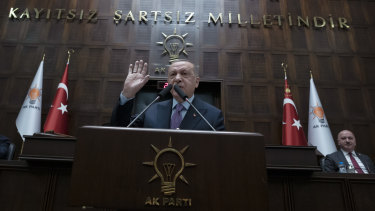 Turkey's President Recep Tayyip Erdogan speaks to his supporters in Parliament.