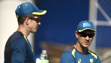 Justin Langer (right) with skipper Tim Paine.