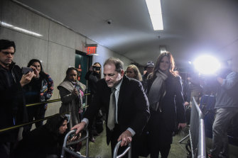 Weinstein leaves court during his trial.
