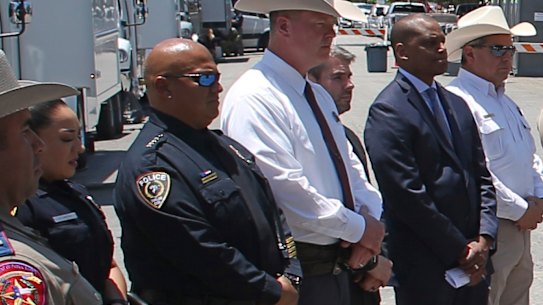 Uvalde School Police Chief Pete Arredondo, third from left, stands during a news conference outside of the Robb Elementary school in Uvalde, Texas on May 26.